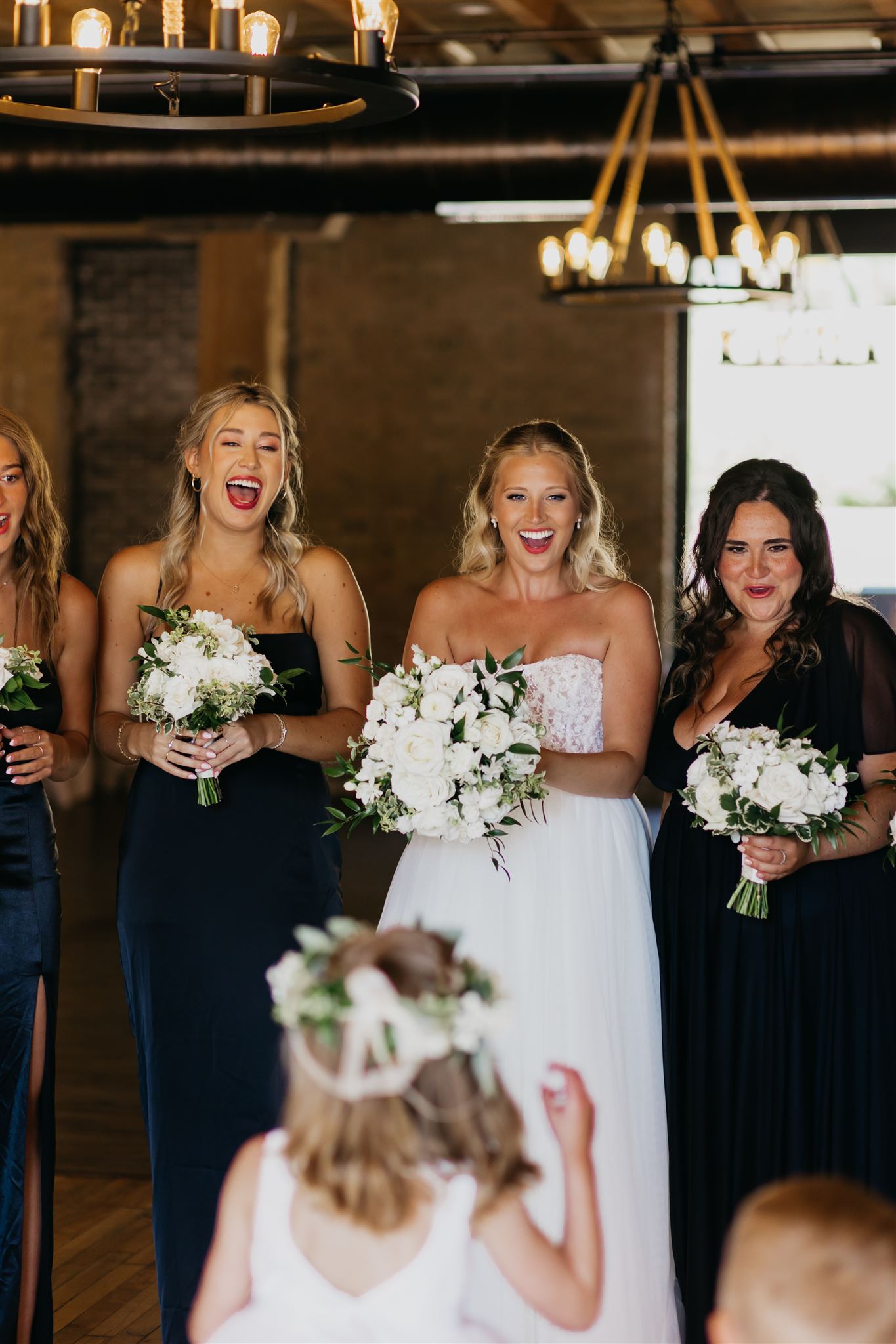 A shot of the bride and her bridesmaids surprised
