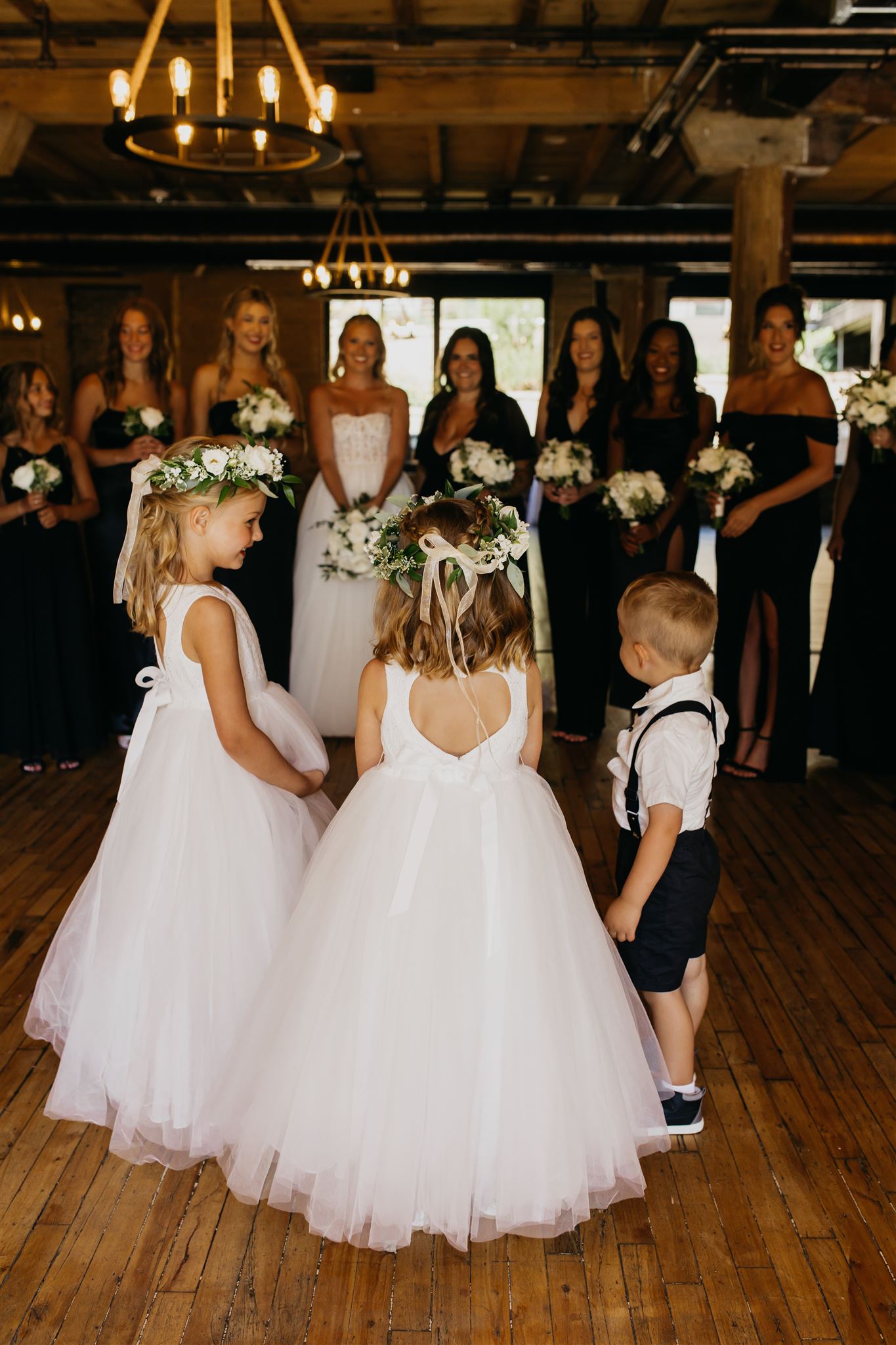 The flower girls and the ring bearer surprised the bride and her bridesmaids
