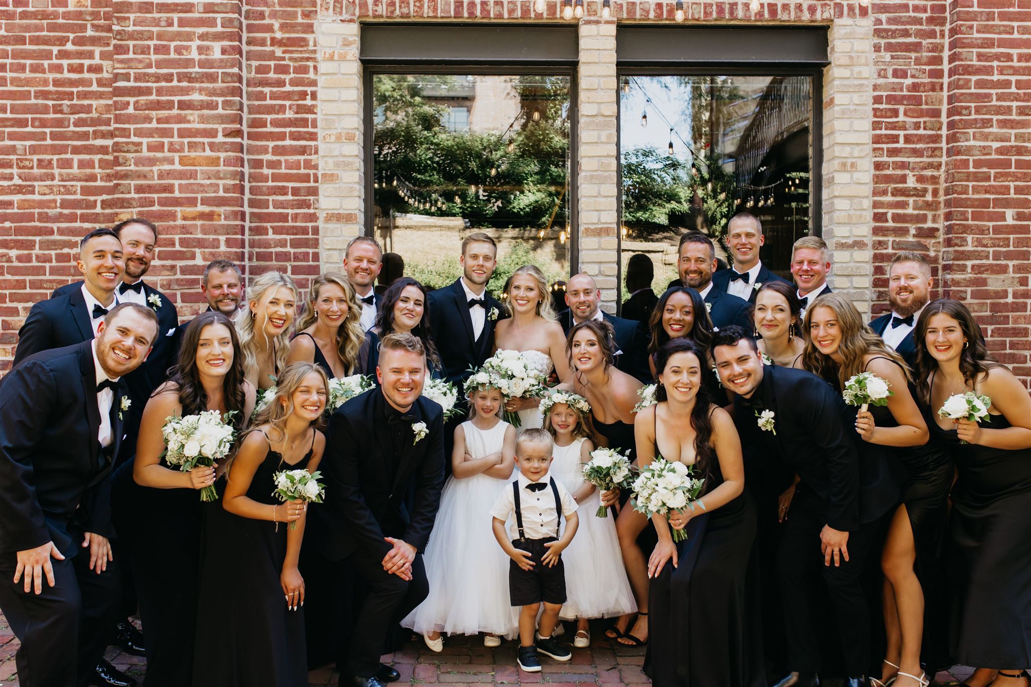 A cute photo of the bride and groom's loved ones on their wedding day