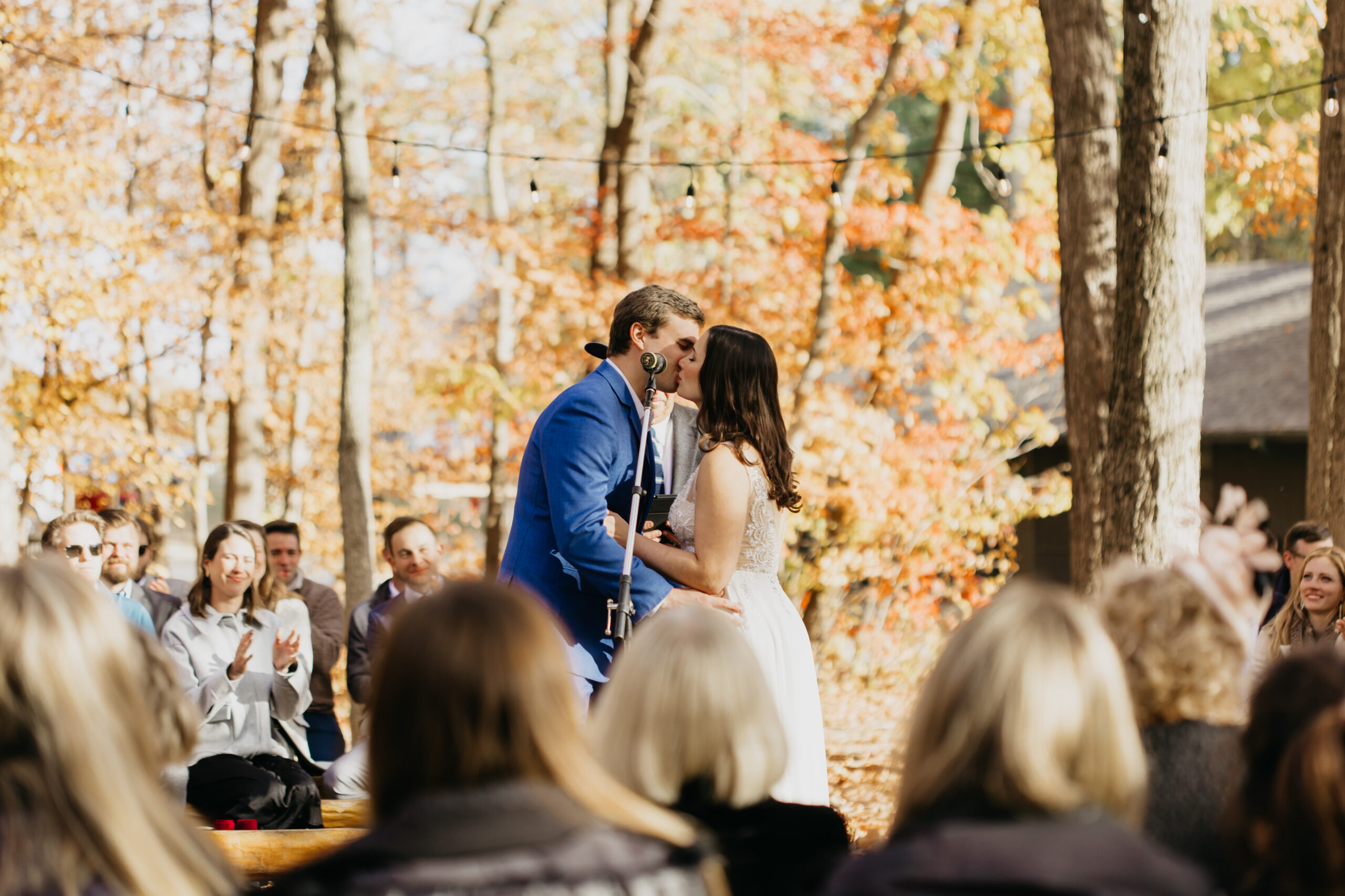 The bride and groom's first kiss as a newlywed couple.