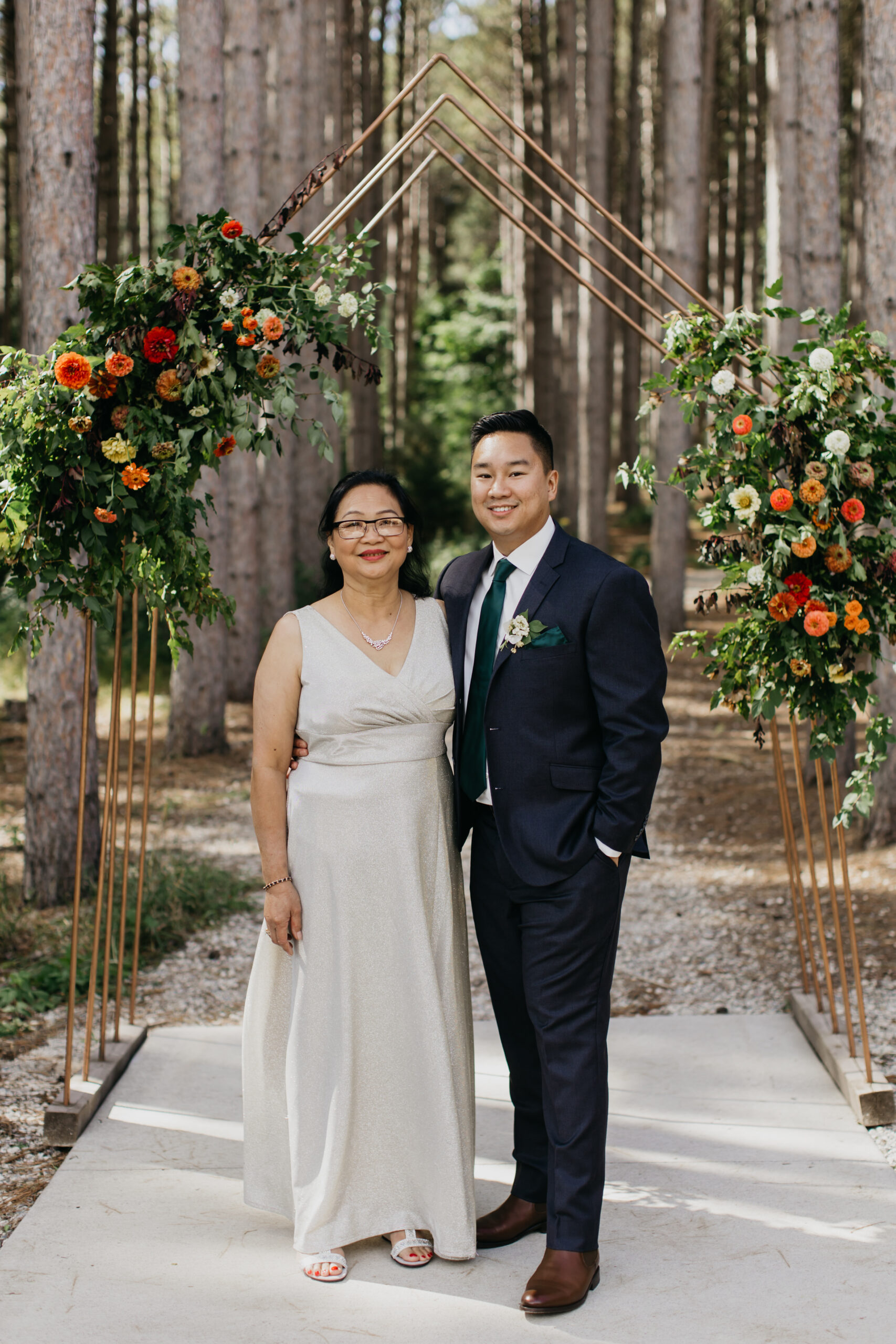 A photo of the groom and his mother during the wedding ceremony