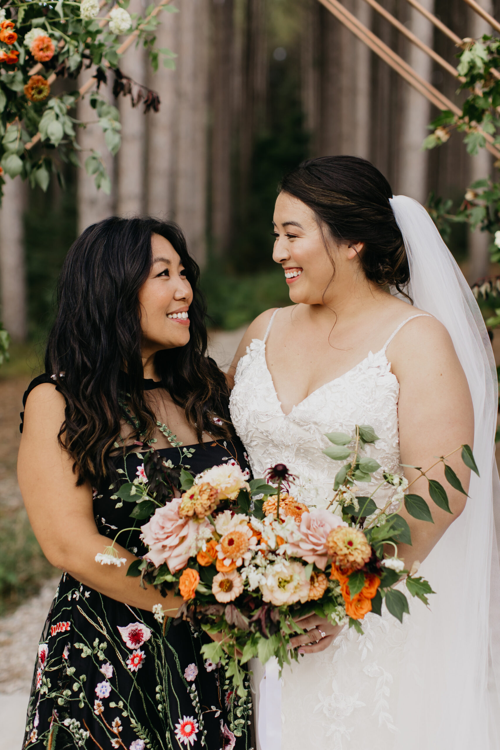 A photo of the bride and her mother during the wedding ceremony