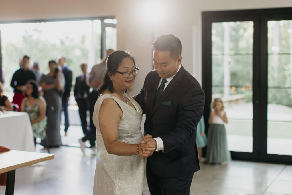 Photo of the groom and his mother dancing during the wedding ceremony