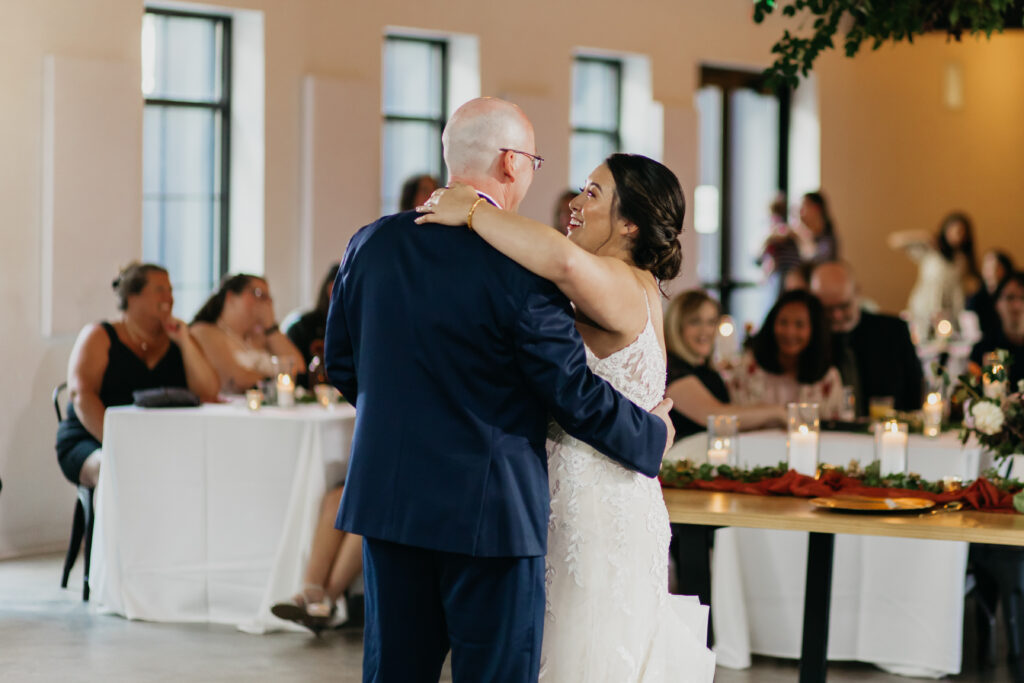 Photo of the bride and her father dancing during the wedding ceremony