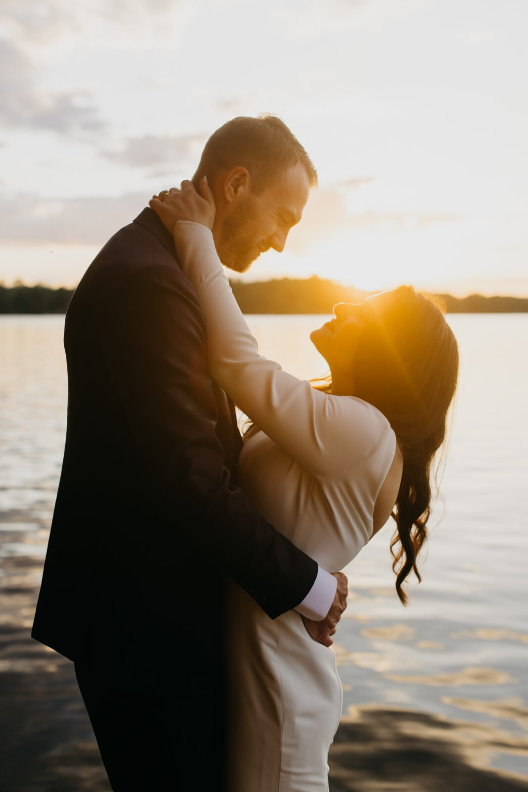 A lovely photo of the bride and groom  during a sunset on their wedding day
