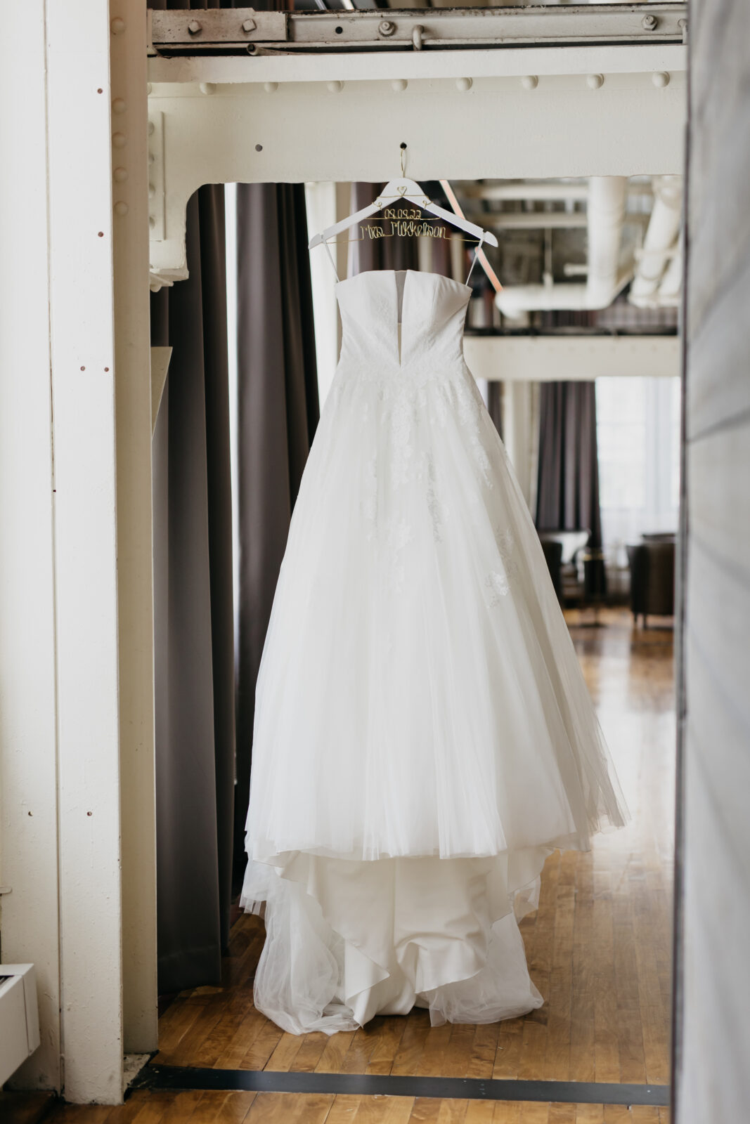 A photo of the bride's white gown