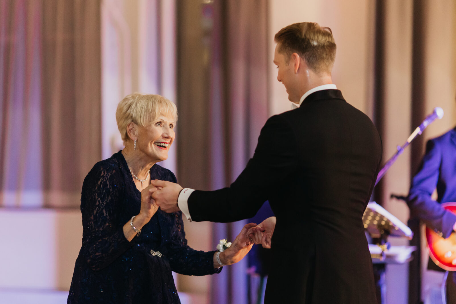 A photo of the groom dancing with his mother on his wedding day