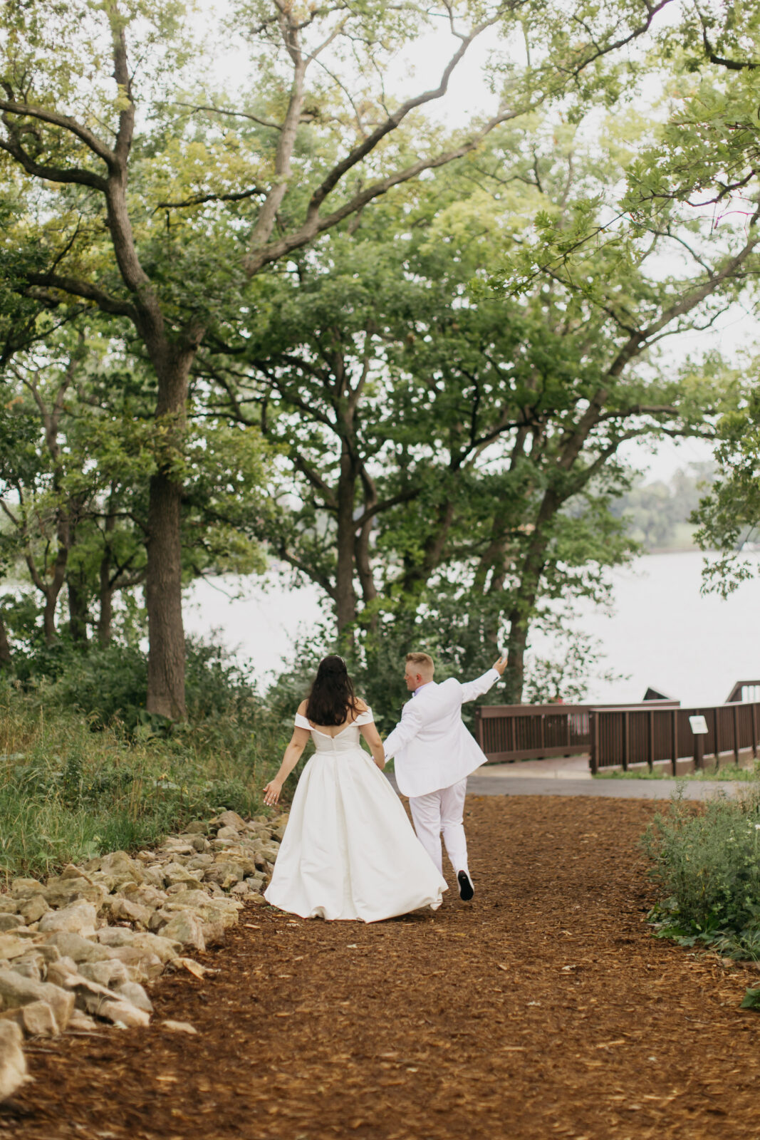 A lovely photo of the bride and groom on their wedding day with the nature as the background for the shoot