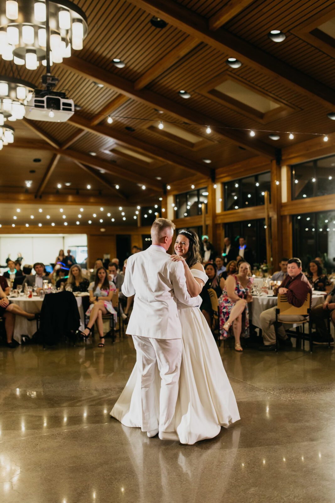 A photo of the bride and groom during their first dance as a wedding couple