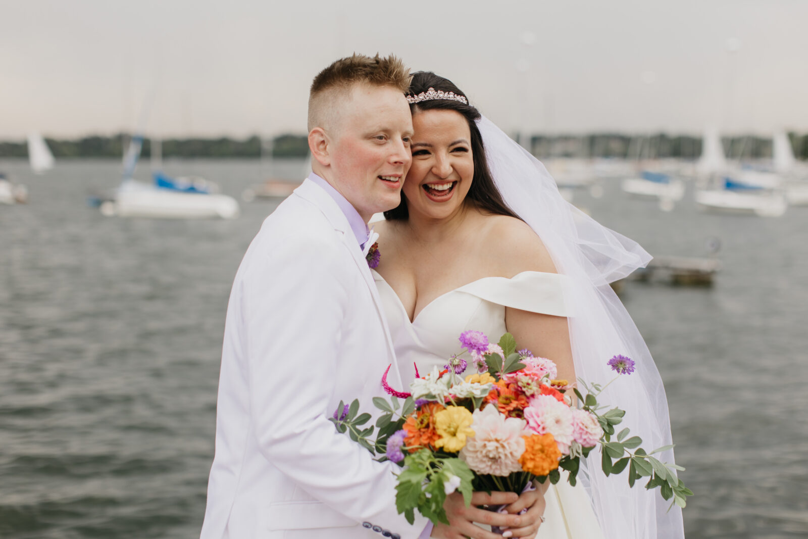 Photo of the bride and groom during their first looks at Lake Harriet