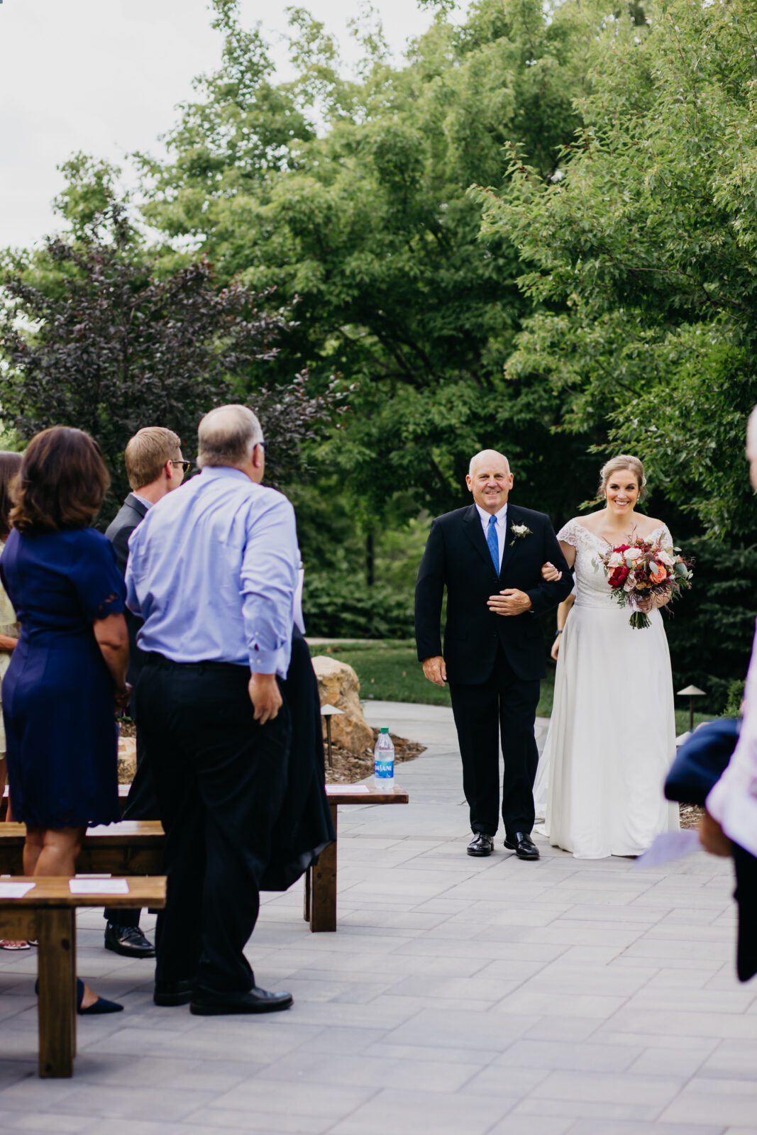 A photo of the bride walking down the aisle with her father