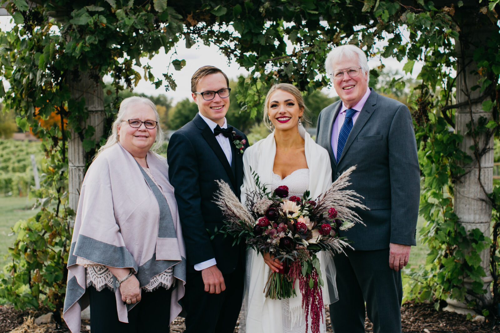 Family photos with the bride and groom during their wedding day