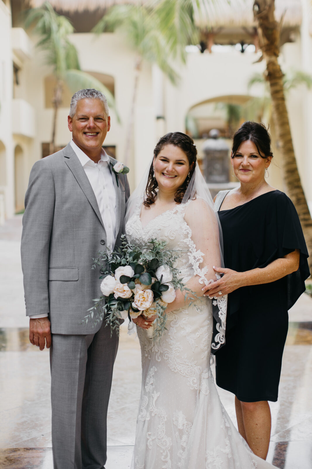 A photo of the bride and her parents