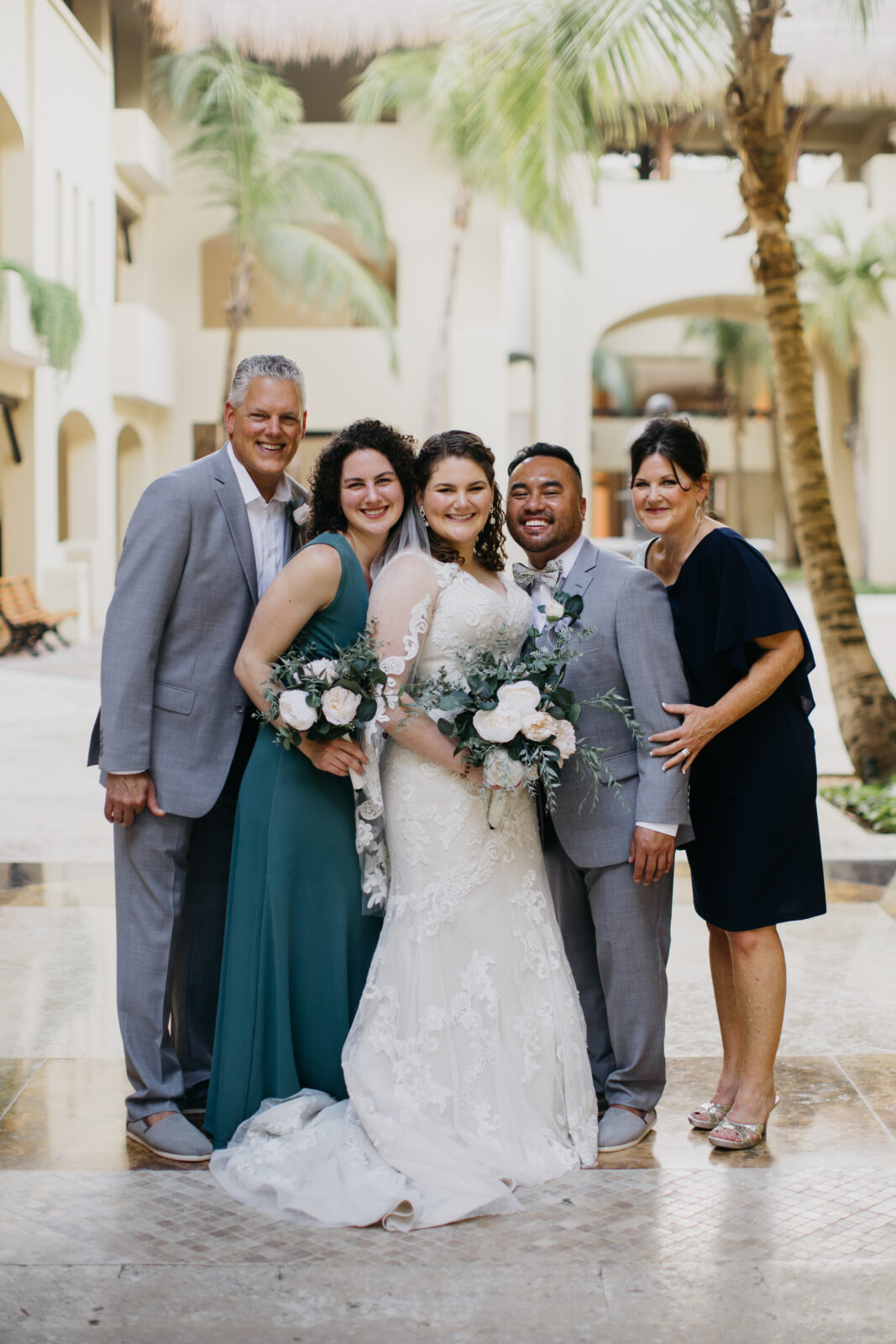 A photo of the wedding couple and the bride's family