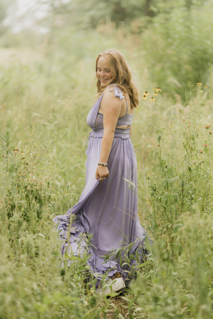 Photo of a Breck High School senior named Maya during her photo session wearing a purple flowy dress