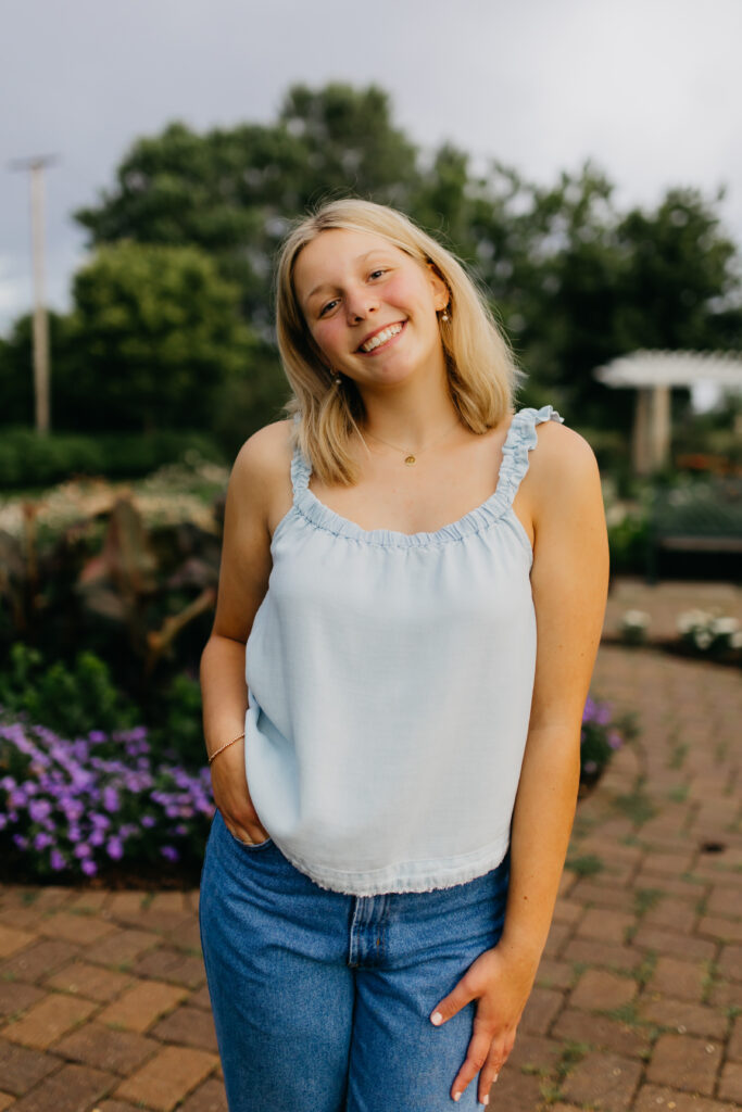 Edina High School Photos of a Senior in white top and blue jeans