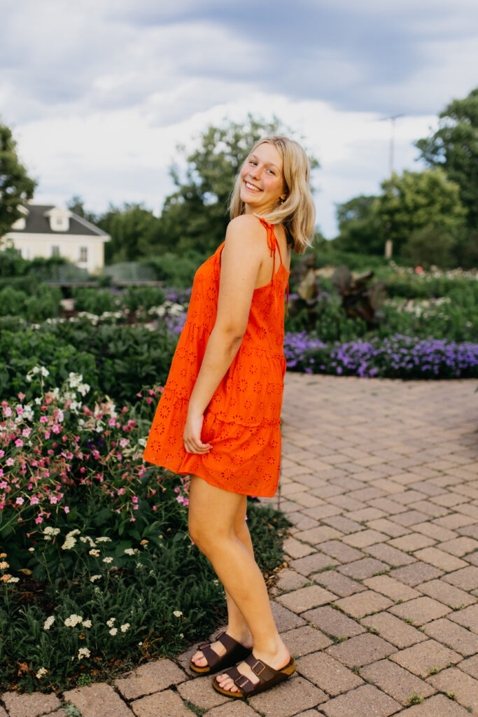 Edina High School Photos of a Senior in a vibrant orange dress