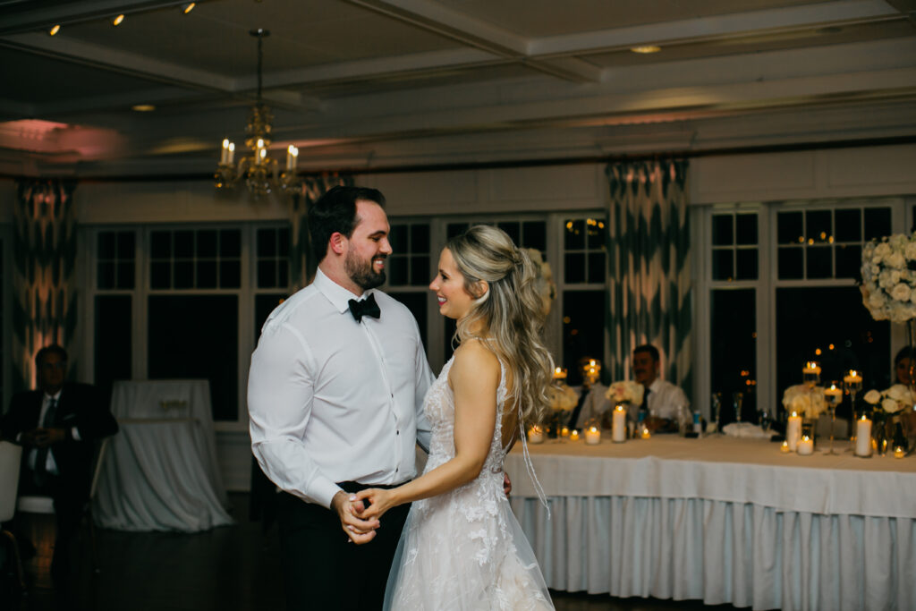 Photo of the bride and groom having their first dance as married couples on their wedding day