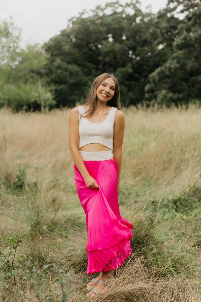 Edina Senior photos in the field and trees as background