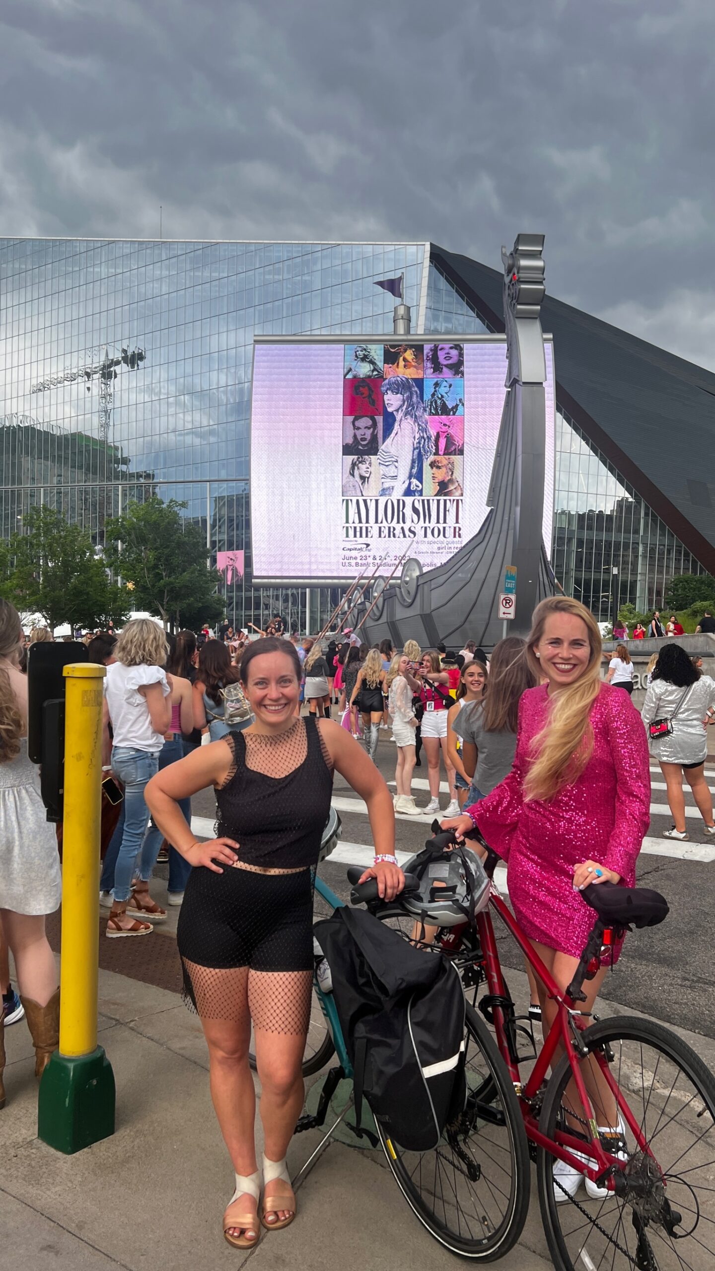 Photo of 2 girls taking a photo outside U.S. Bank Stadium for Taylor Swift's The Eras Tour concert