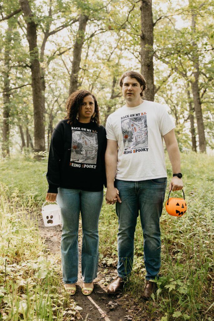 a lovely photo of a couple during their silverwood park engagement photos with their halloween props