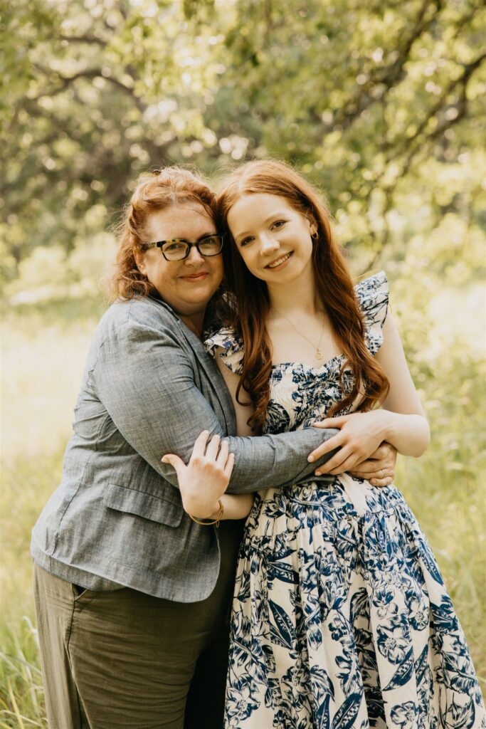 A photo of a high school senior with her mom
