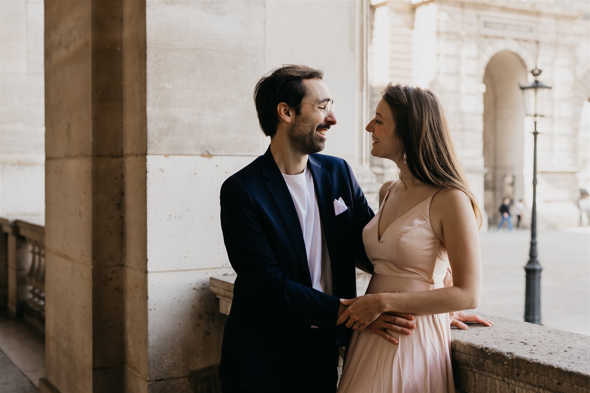 Photo of a couple during their engagement photos at the louvre