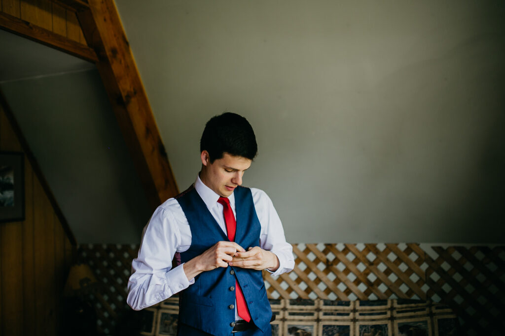 Groom getting ready for his Glacier National Park Wedding