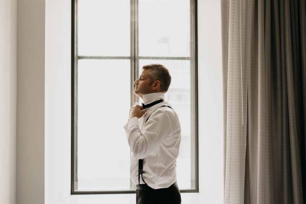 Photo of a groom getting ready
