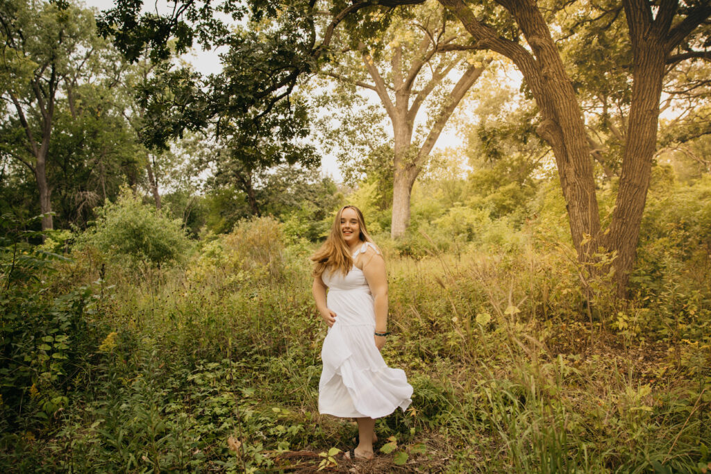 Edina High School Senior, Maggie , during her session at the forest and field location.