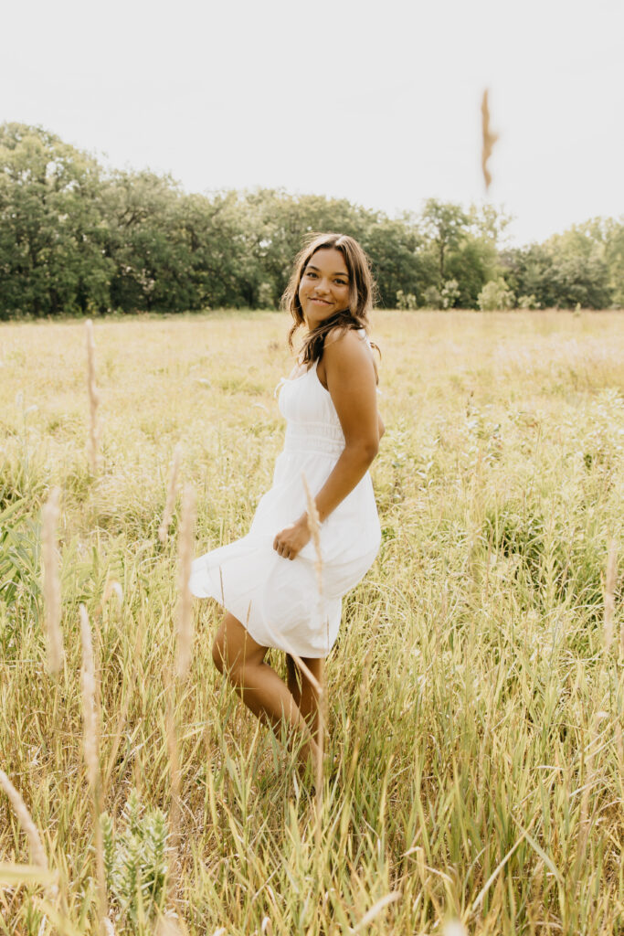 Washburn High School senior posing at the field.