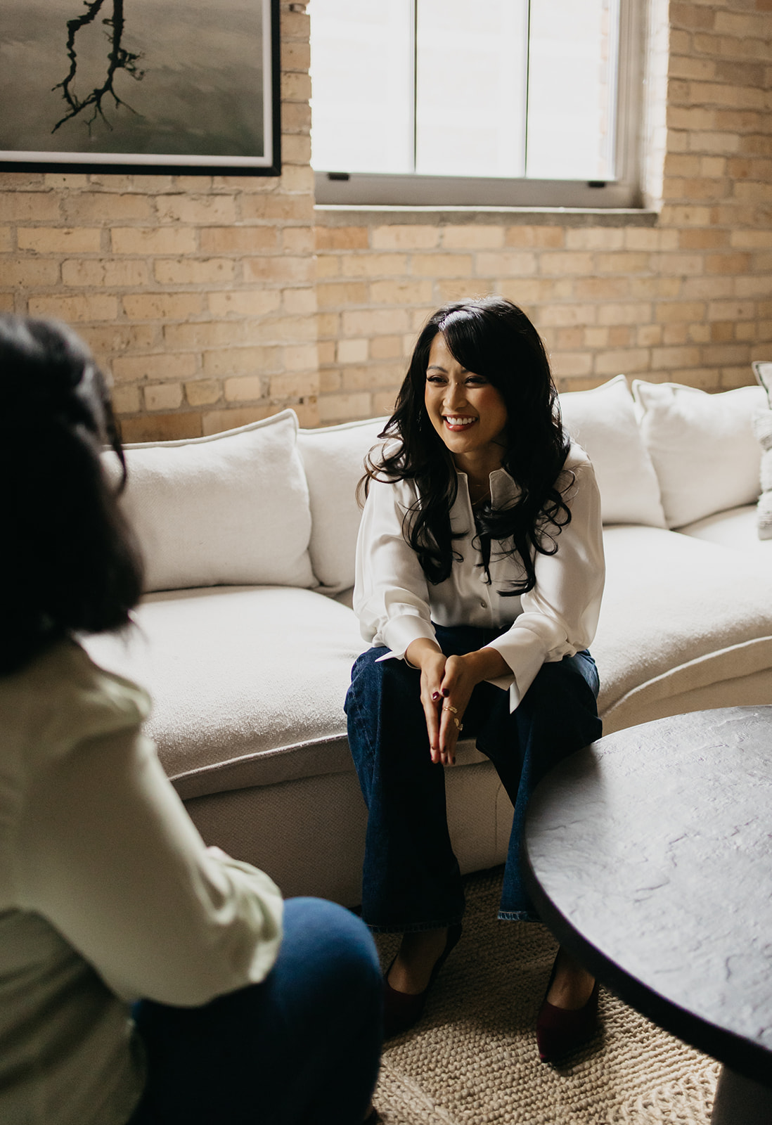 Woman talking to her Clients | Branding Photography