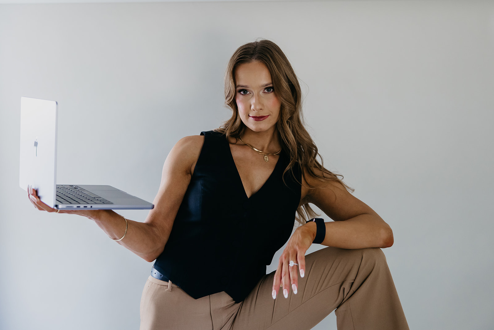 Woman holding a laptop 