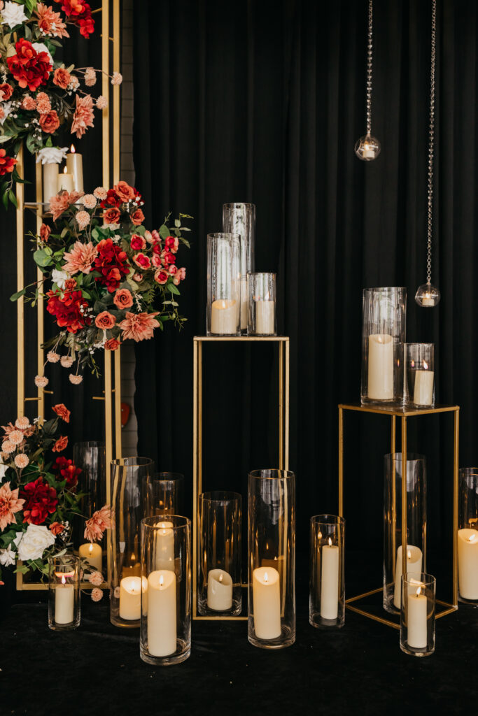 andlelit reception décor with florals and modern gold stands at Renaissance Depot wedding | Captured by Mycah Bain Photography, traditional wedding