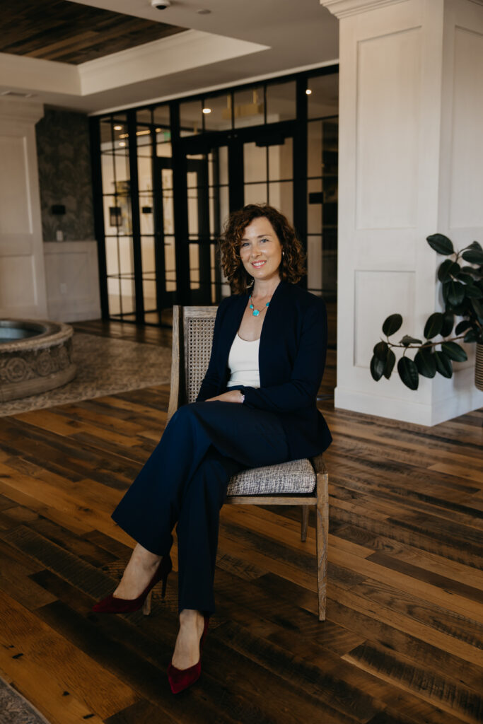 Anne Deanovic, founder of Hot Mustard PR, poses in a modern indoor space near 50th and France for her Edina brand photography session with Mycah Bain Photography.