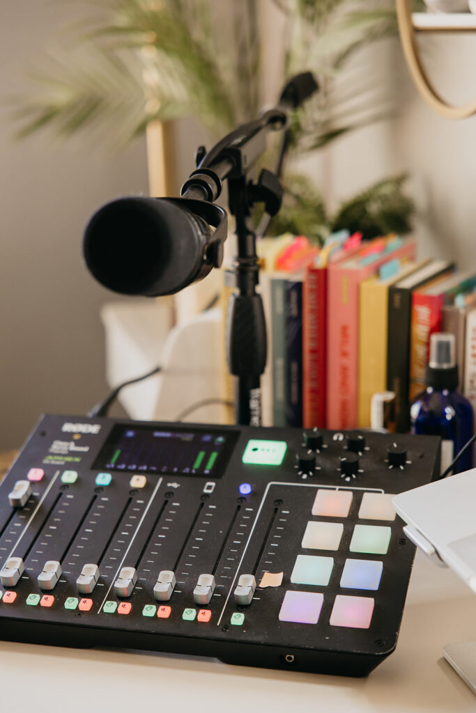 Detail shot of professional podcast mixing board and microphone during brand photography session