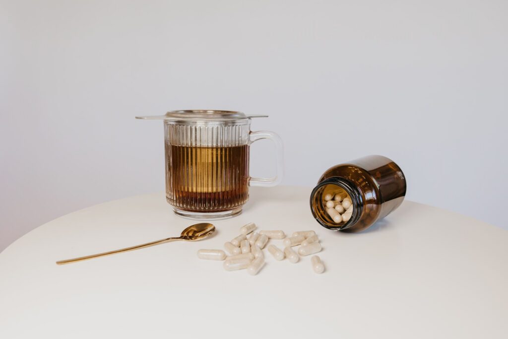 Herbal tea mug with supplement capsules during integrative medicine brand photography Minneapolis