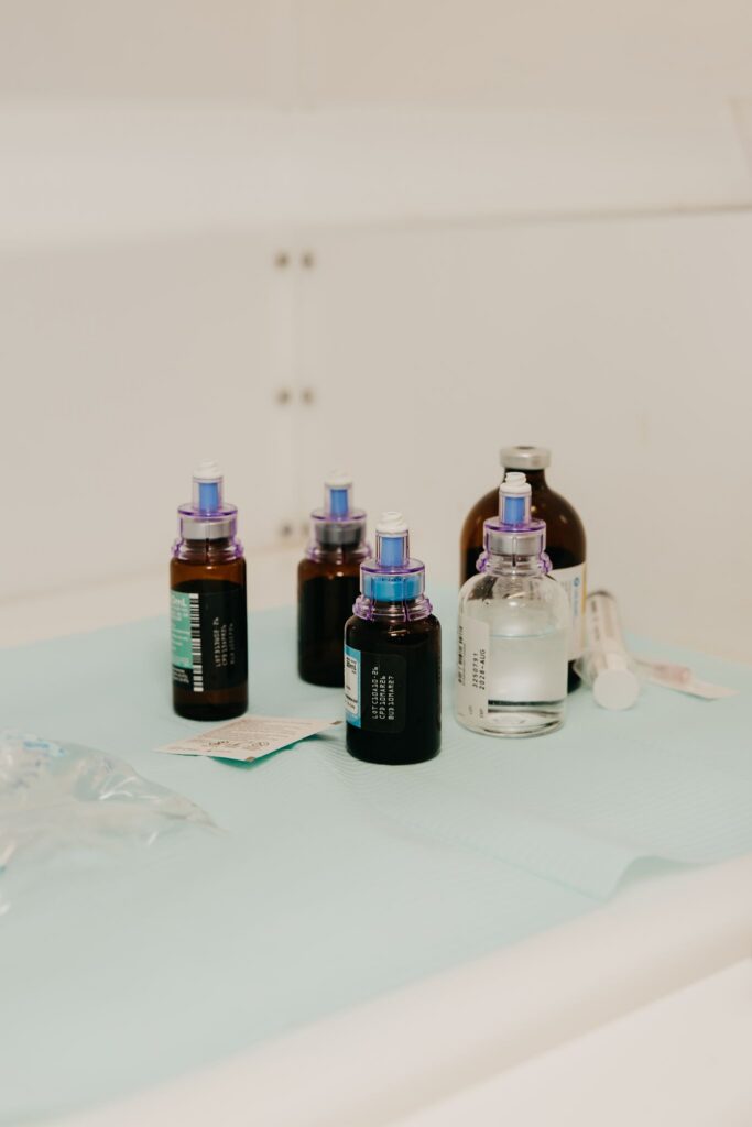 IV infusion vials and bottles on tray during healthcare brand photography Minneapolis MIMC
