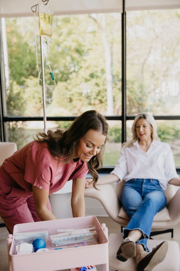 MIMC nurse sitting with patient during IV infusion therapy brand photography Minneapolis