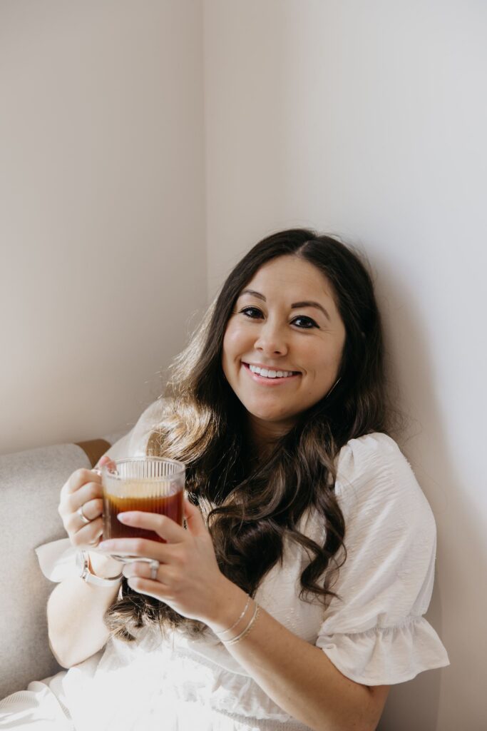 MIMC provider smiling with coffee cup during integrative medicine brand photography Minneapolis