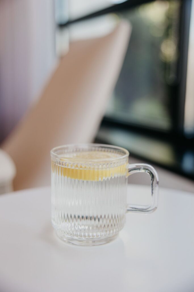 Herbal tea in ribbed glass mug during integrative medicine brand photography session Minneapolis