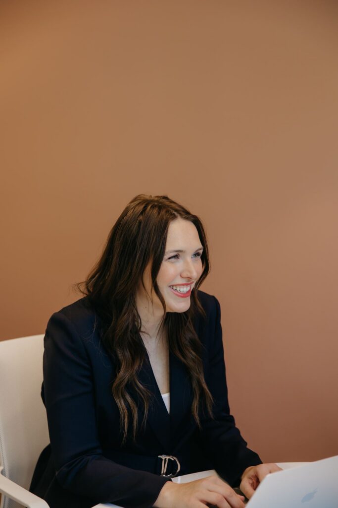 MIMC provider in dark blazer during healthcare brand photography consultation session Minneapolis