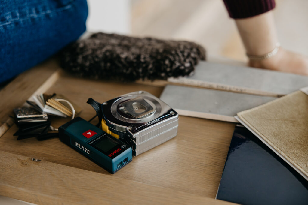 Tools and measuring equipment in a flat lay, brand photography for a contractor business
