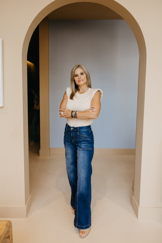 CLEO Skin + Laser staff member standing in archway hallway of Minneapolis skincare clinic
