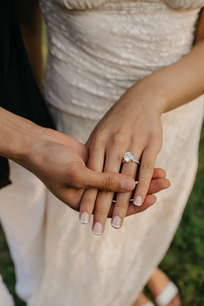 close-up of a woman's hand showing her engagement ring