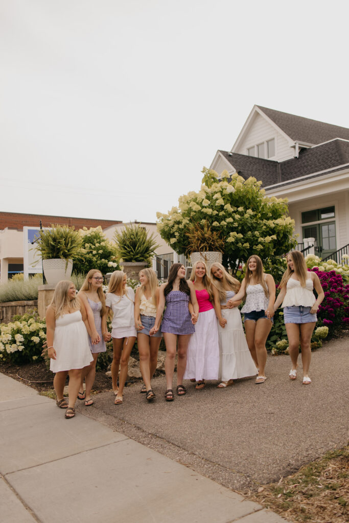 senior friend group walking together down a sidewalk in Minneapolis