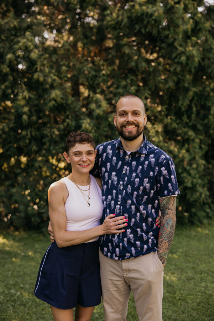 Young couple standing close together smiling at a Minneapolis family reunion session