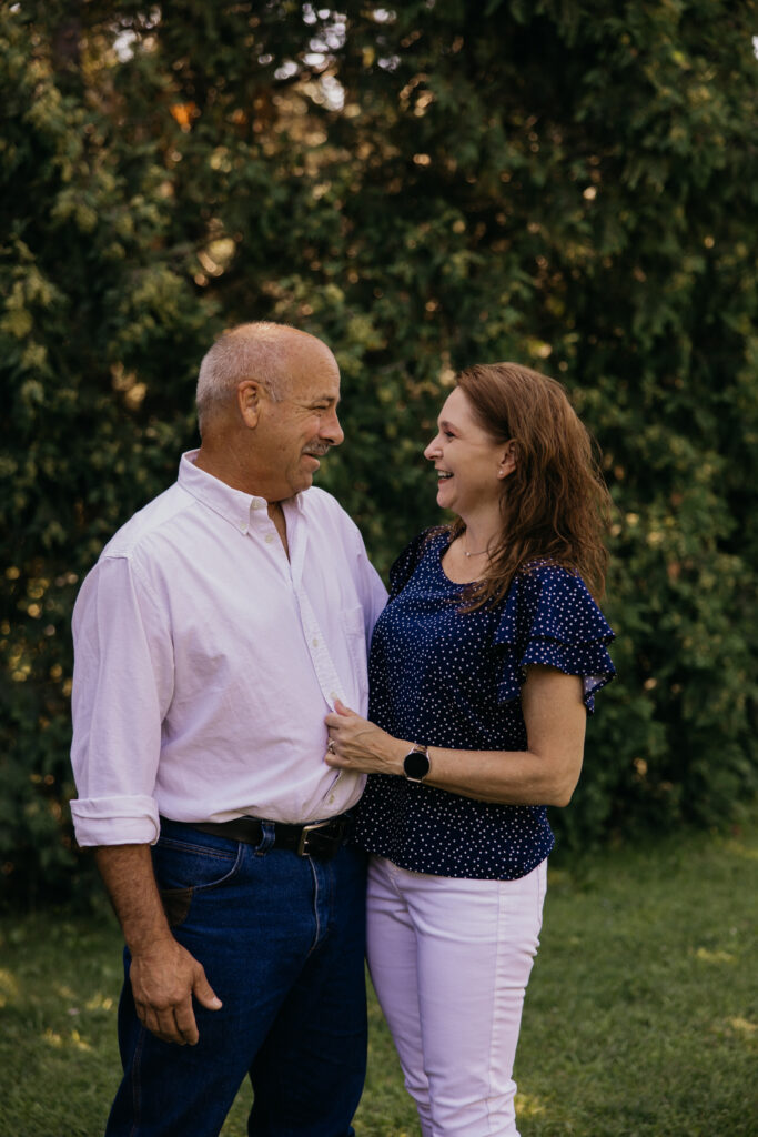 Grandparents smiling at each other during golden hour at a family reunion session
